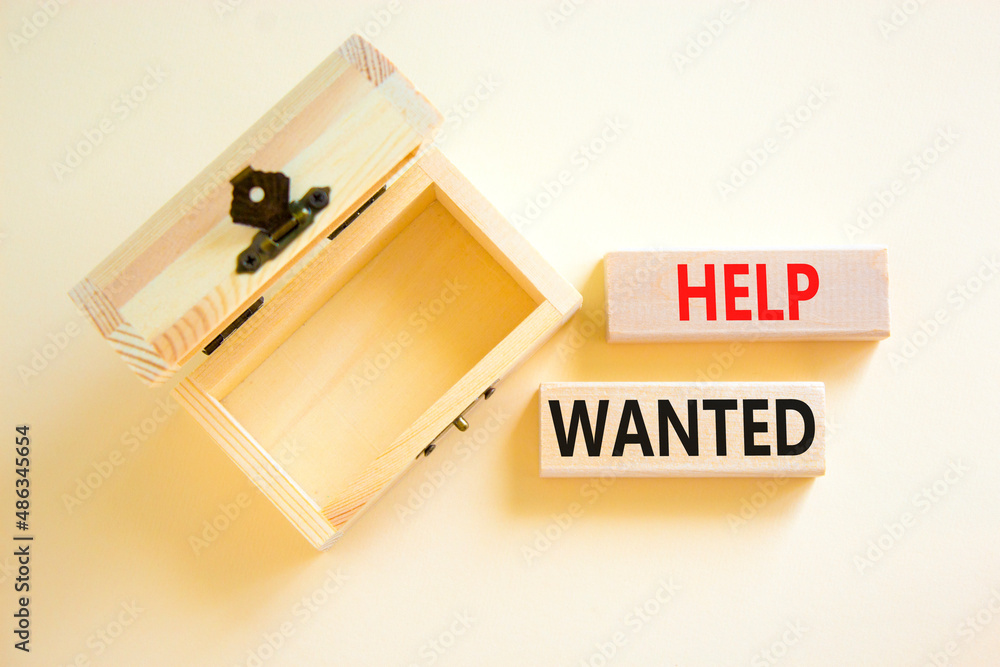 Help wanted and support symbol. Concept words Help wanted on wooden blocks on a beautiful white table white background. Empthy wooden chest. Business support and help wanted concept, copy space. Help wanted and support symbol. Concept words Help wanted on wooden blocks on a beautiful white table white background. Empthy wooden chest. Business support and help wanted concept, copy space.