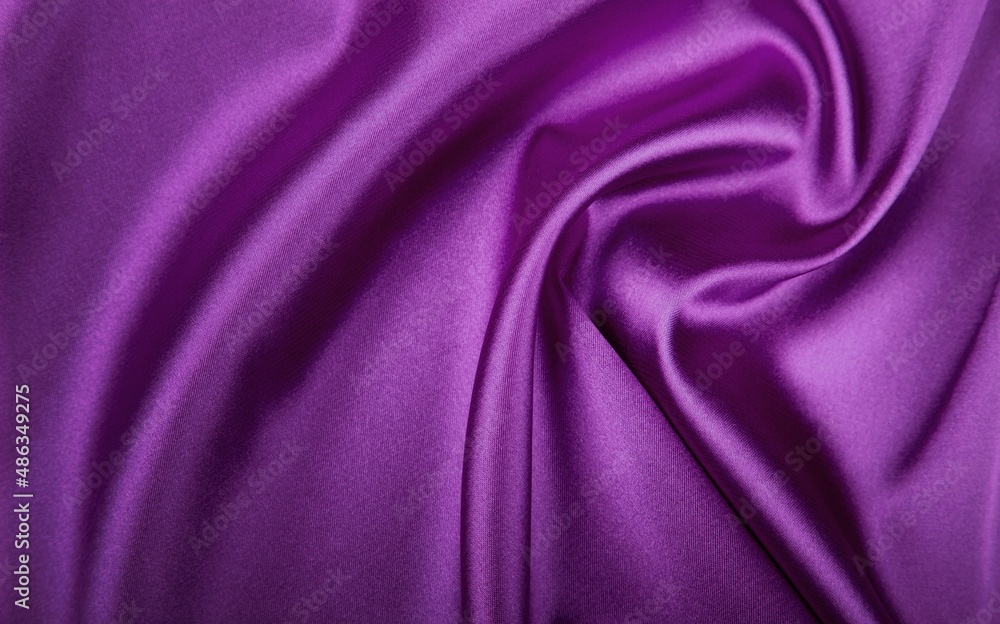 Obraz premium Deep, rich, purple colored satin. Folded and flowing background. Luxury fashion concept. Trend color 2022 - Velvet Violet