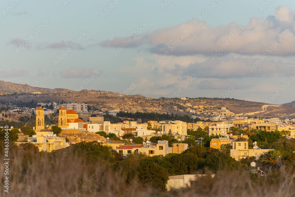 The city of Paphos in the setting sun from the coast. Late autumn in Cyprus.