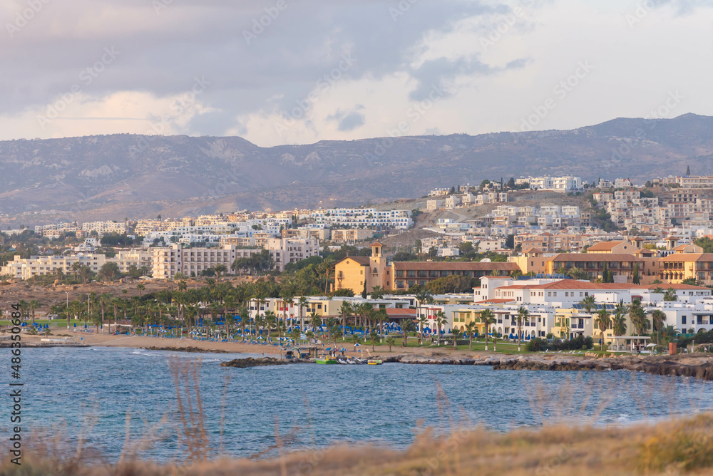 The city of Paphos in the setting sun from the coast. Late autumn in Cyprus.