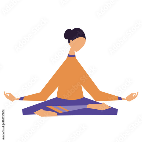 A young woman practices yoga in the lotus position.