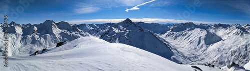 Skitour on the sentisch horn. Mountaineering in a wonderful mountain world in davos switzerland. snowy mountain peaks photo