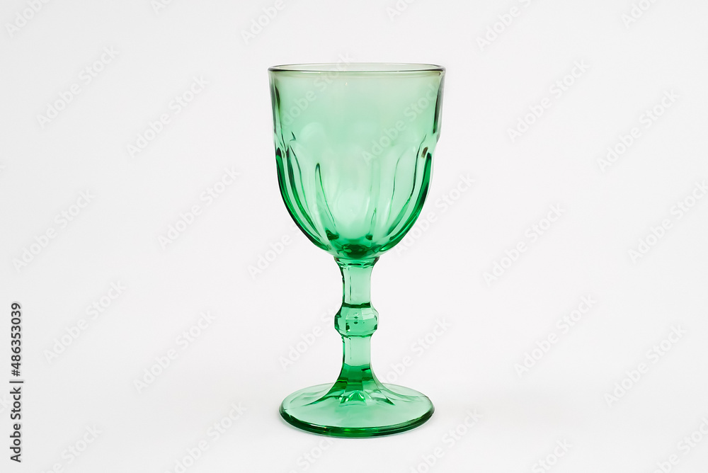 Isolated green wine glass champagne glass. Gray background. Isolated green wine glass champagne glass. Gray background.