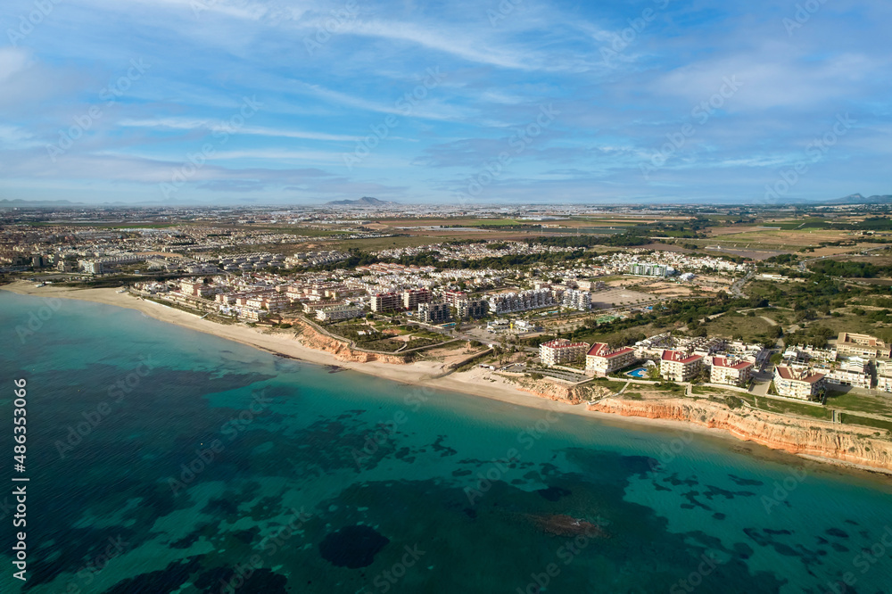 Aerial view picturesque sandy beach of Mil Palmeras. Spain