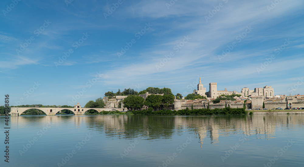 Avignon, Vaucluse - France - July 10 2021: Roine river with Palais des papes and 