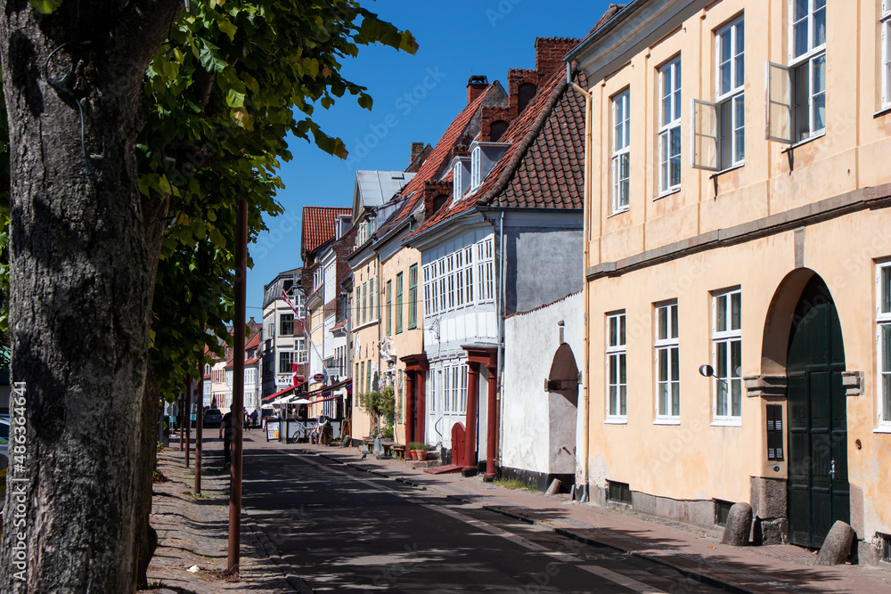  Street of old town on a summer sunny day. Expensive housing in the center of the city. Rent an apartment. Real estate investment. Tourism in Denmark.