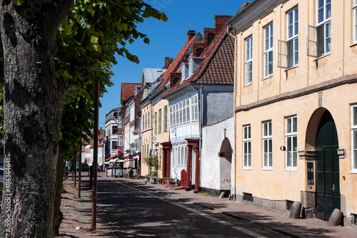  Street of old town on a summer sunny day. Expensive housing in the center of the city. Rent an apartment. Real estate investment. Tourism in Denmark.