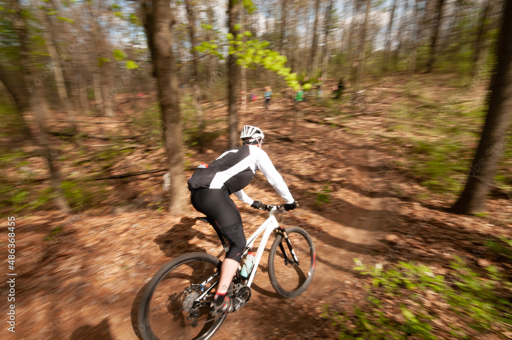 man in a mountain bike race from the back