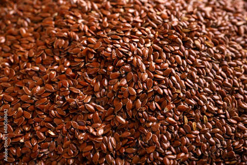 Organic Flax seeds on rustic table. Vegan food.