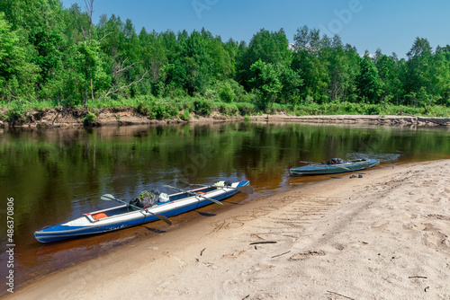 Outdoor activities forest river reflection of sky and kayak © Алексей Ромадов