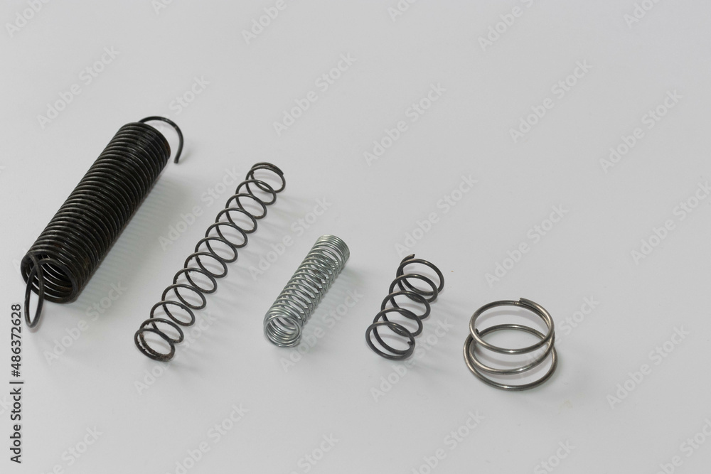 Fototapeta premium Chrome metal spring. Metal extension spring, machine part.