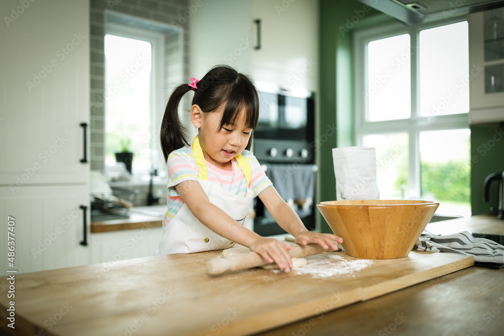 young girl making bread dough at home kitchen for home schooling young girl making bread dough at home kitchen for home schooling