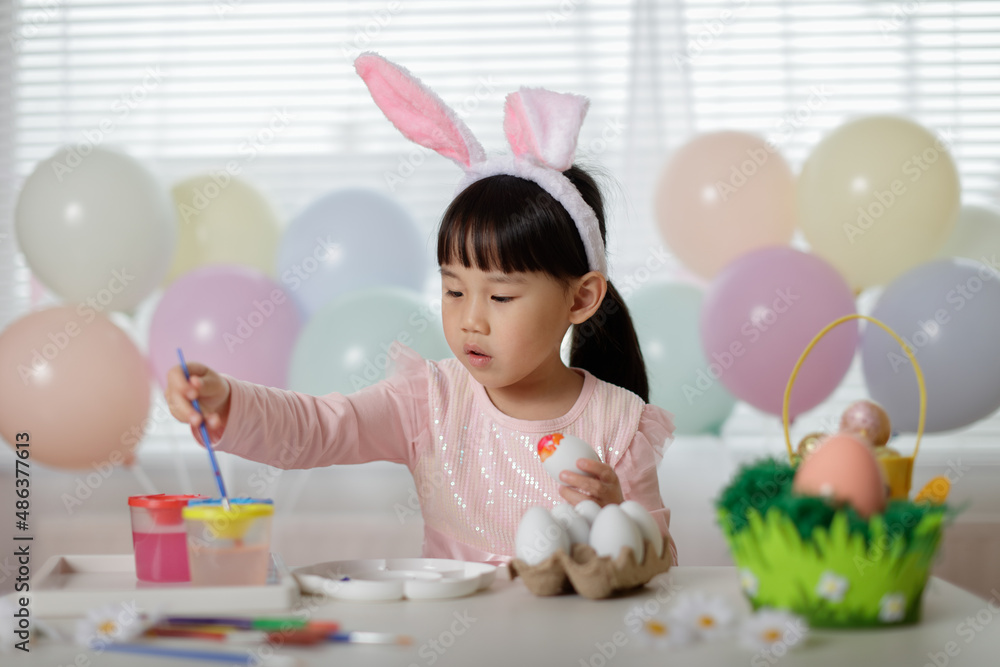 young girl making easter craft at home young girl making easter craft at home