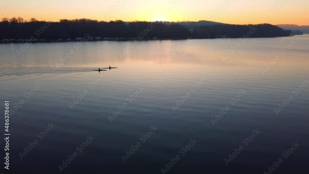 Aerial dron view of lake, water and silhouette of trees during sunset. Evening nature, beautiful landscape. FullHD footage Aerial dron view of lake, water and silhouette of trees during sunset. Evening nature, beautiful landscape. FullHD footage
