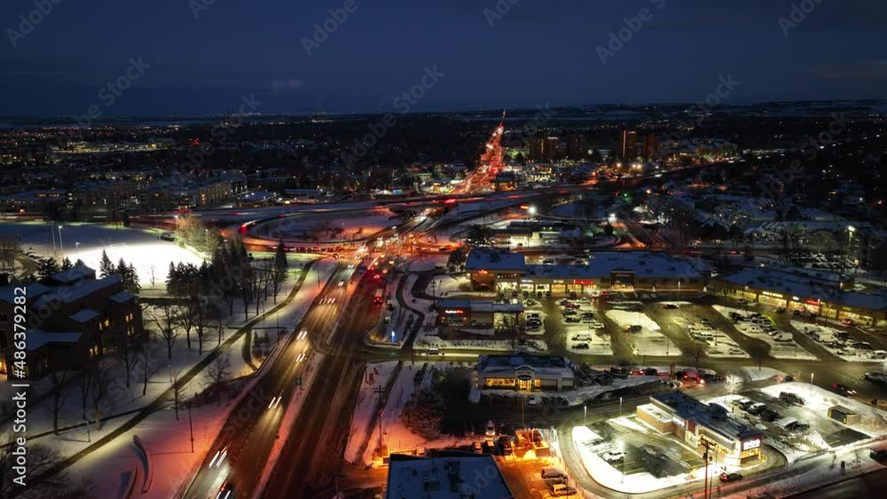 Aerial timelapse of evening rush hour traffic. Drone hyperlapse of cars whizzing along the roads with snow in Boulder, Colorado Aerial timelapse of evening rush hour traffic. Drone hyperlapse of cars whizzing along the roads with snow in Boulder, Colorado