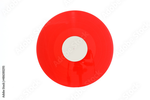 Red Vinyl record on a white   background. Retro style. Top view. Flat lay, copy space. 