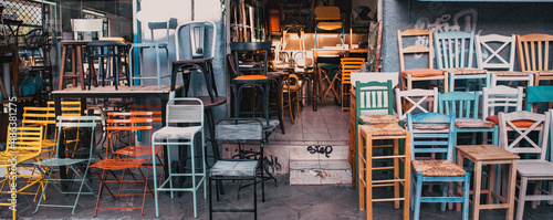 old colorful chairs in a second hand shop photo