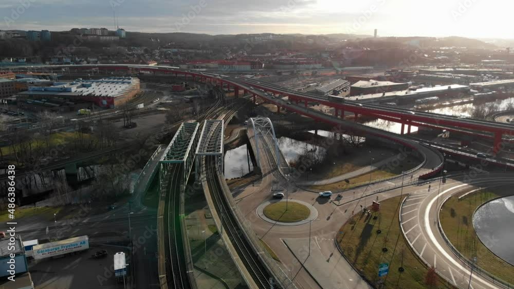 Drone shot of round about, roads, and bridges - Partihallsförbindelsen viaduct in Gamlestaden, Gothenburg, Sweden - Aerial view Drone shot of round about, roads, and bridges - Partihallsförbindelsen viaduct in Gamlestaden, Gothenburg, Sweden - Aerial view