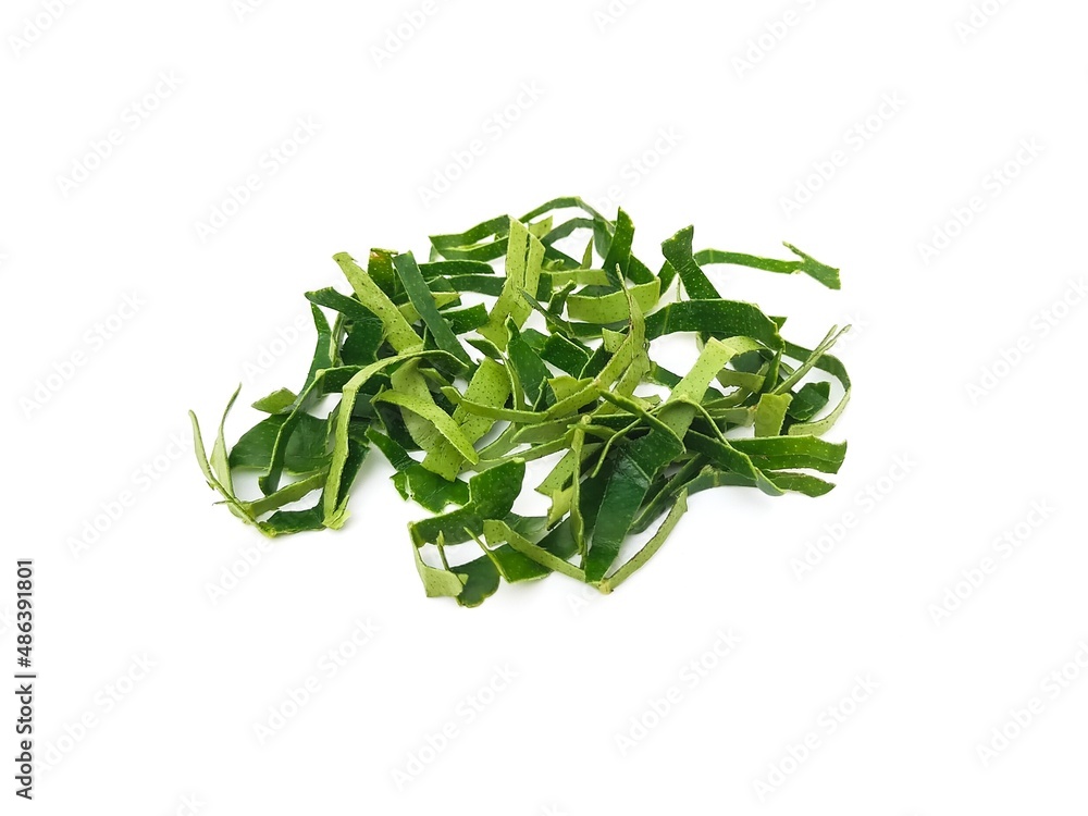 Fresh organic kaffir lime leaves, no chemicals, cut into pieces as a cooking ingredient. Green leaves, placed on a white background. Fresh organic kaffir lime leaves, no chemicals, cut into pieces as a cooking ingredient. Green leaves, placed on a white background.