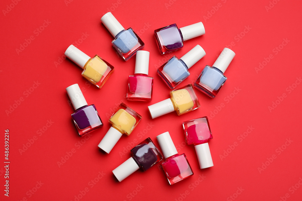 Set of nail polish bottles on color background Set of nail polish bottles on color background