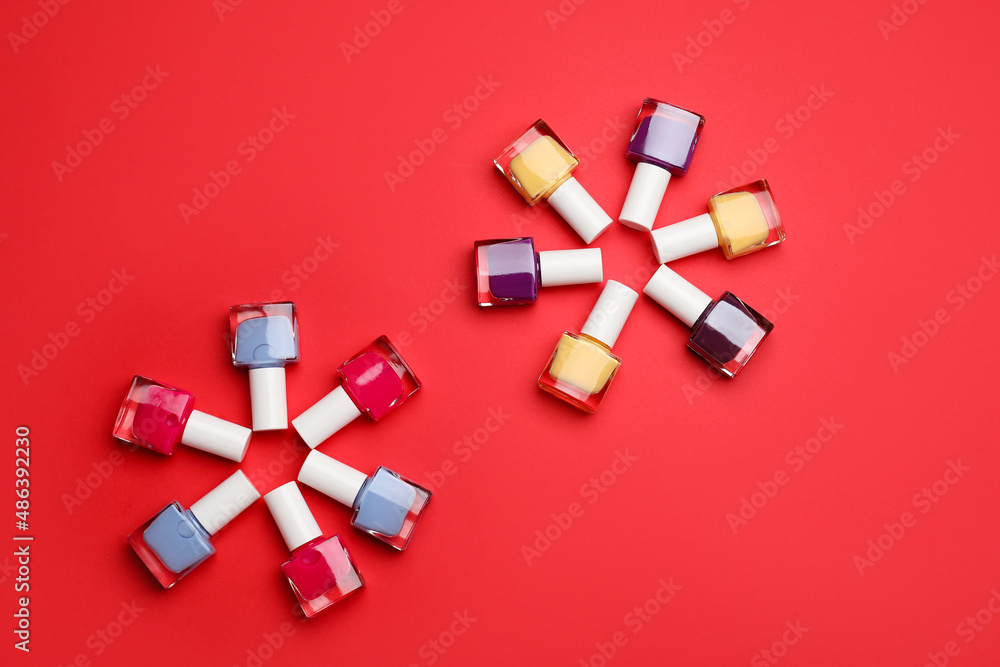 Set of nail polish bottles on color background Set of nail polish bottles on color background