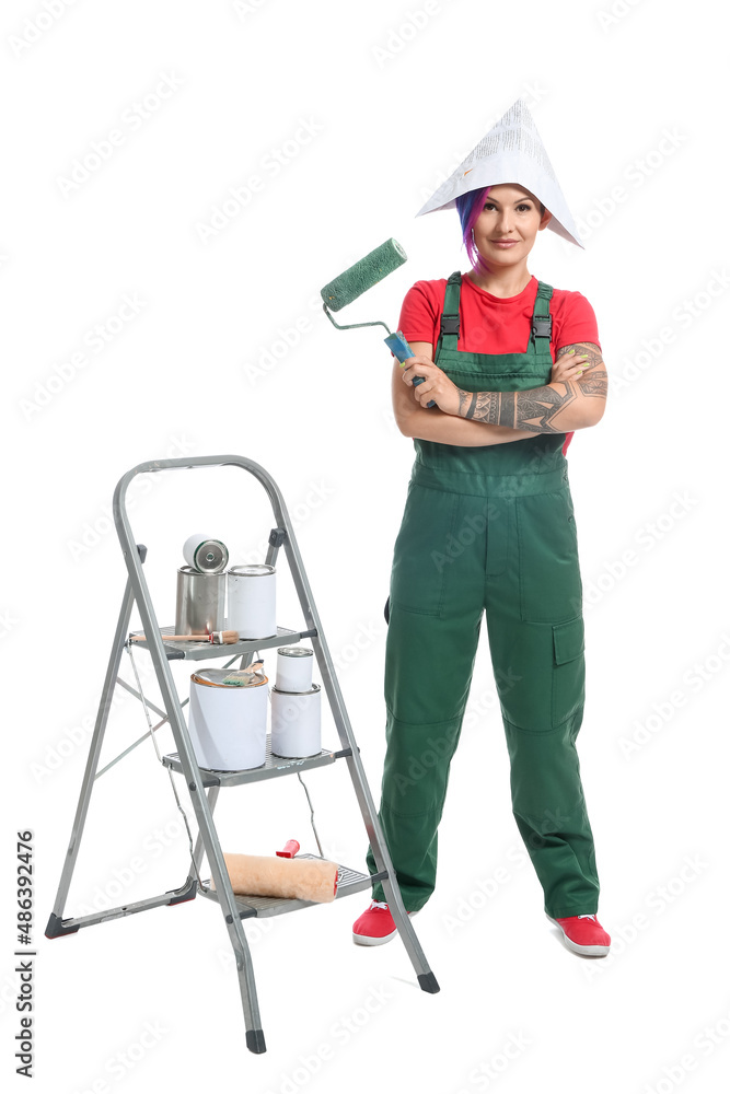 Female painter with paper hat, paint roller and ladder on white background Female painter with paper hat, paint roller and ladder on white background