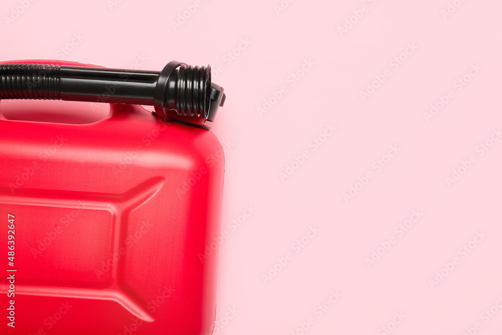 Plastic canister with rubber nozzle on color background Plastic canister with rubber nozzle on color background