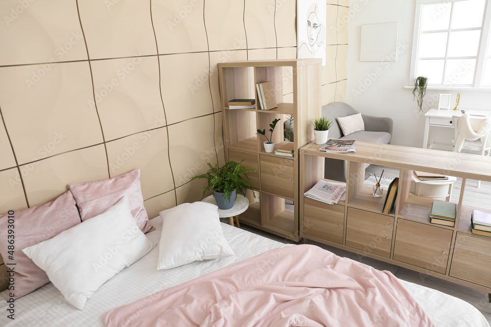 Wooden book shelf in interior of modern bedroom Wooden book shelf in interior of modern bedroom