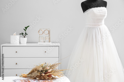 Bouquet of flowers and mann...