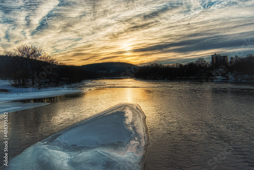 Taken from the South Washington Street Bridge in Binghamton in Upstate NY.  Ice on the river at Sunset.  This is the point where the Chenango and the Susquehanna River Converge into one.    photo