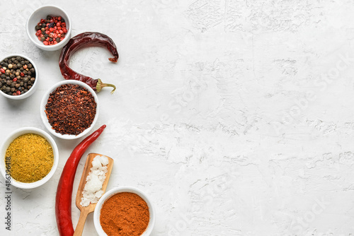 Set of different spices on light background