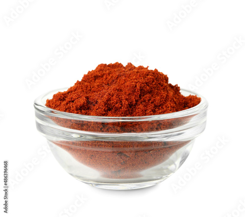 Bowl of aromatic paprika powder on white background