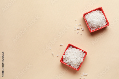 Two red bowls of coarse sea...