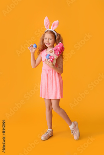 Funny little girl with bunn...