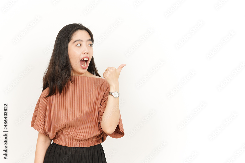 Showing and Pointing Product With Thumb Of Beautiful Asian Woman Isolated On White Background Showing and Pointing Product With Thumb Of Beautiful Asian Woman Isolated On White Background