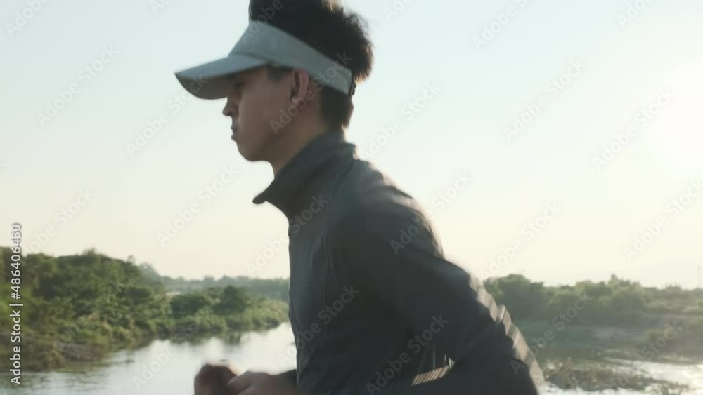 Healthy teenage boys running on the street for exercise. Young male athlete jogging outdoors. Healthy lifestyle concept Healthy teenage boys running on the street for exercise. Young male athlete jogging outdoors. Healthy lifestyle concept