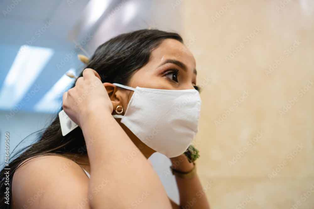 bride putting on a medical mask