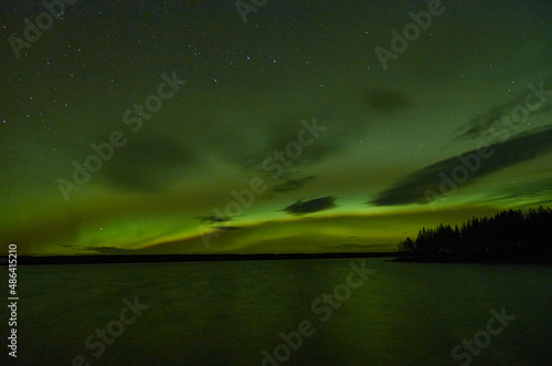 Northern lights over a lake in Suomussalmi Finland photo