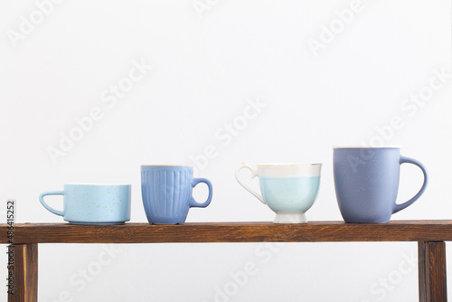 blue cups on white background