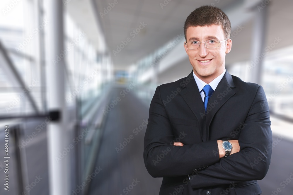 Confident handsome mature businessman professional standing in office posing Confident handsome mature businessman professional standing in office posing