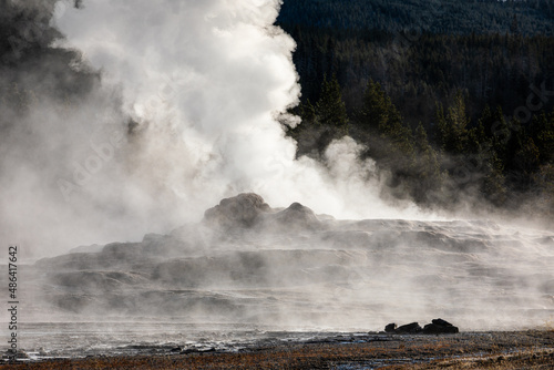 Exploding smoke of old Faithful, famous geyser of Yellowstone