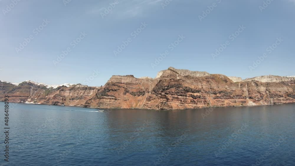 Panoramic view from the ship of Santorinis city of Fira hanging on the volcanic caldera at Santorini island in Aegean sea, Greece Panoramic view from the ship of Santorinis city of Fira hanging on the volcanic caldera at Santorini island in Aegean sea, Greece