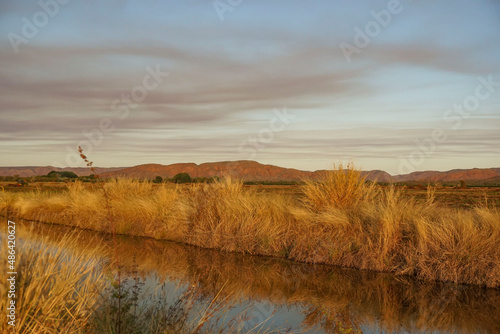 Fototapeta Naklejka Na Ścianę i Meble -  Sunset on irrigation channel Kununurra Western Australia..