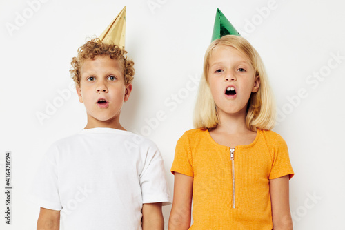 two joyful children with caps on his head holiday entertainment lifestyle unaltered