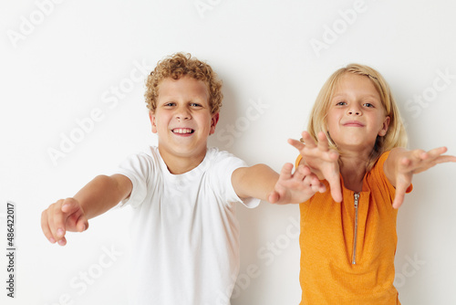 Portrait of cute children hand gestures fun childhood lifestyle unaltered