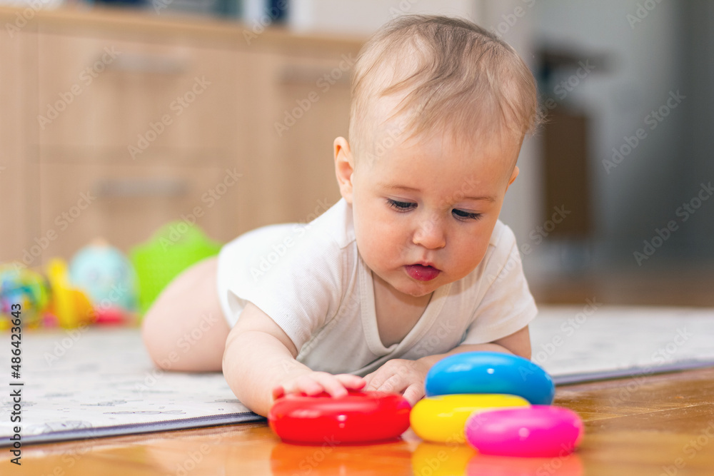 Cute little boy playing with toys at home Cute little boy playing with toys at home