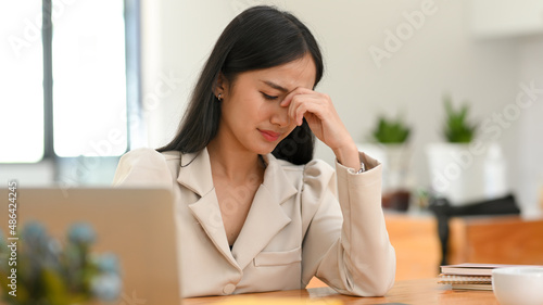 Businesswoman crying over her failure and unsuccessful business project