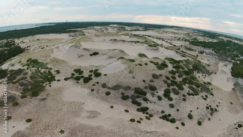 Wallpaper Mural A bird's eye drone shot of the amazing landscape and following a girl running on the high sand dunes and trails in the Dune Shacks Trail in Provincetown, Cape Cod, Massachusetts. 4K UHD FPV Torontodigital.ca