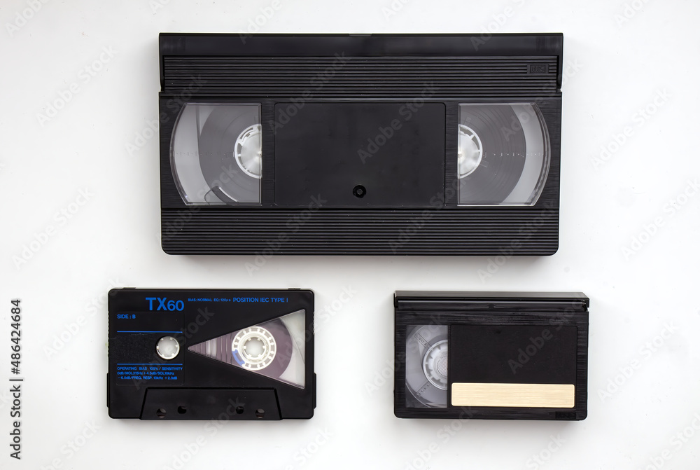 Foto Stock Vintage Media storage cassette tapes evolution: VHS, Audio  Cassette Tape, VHS-C. Technology from the 90s. | Adobe Stock