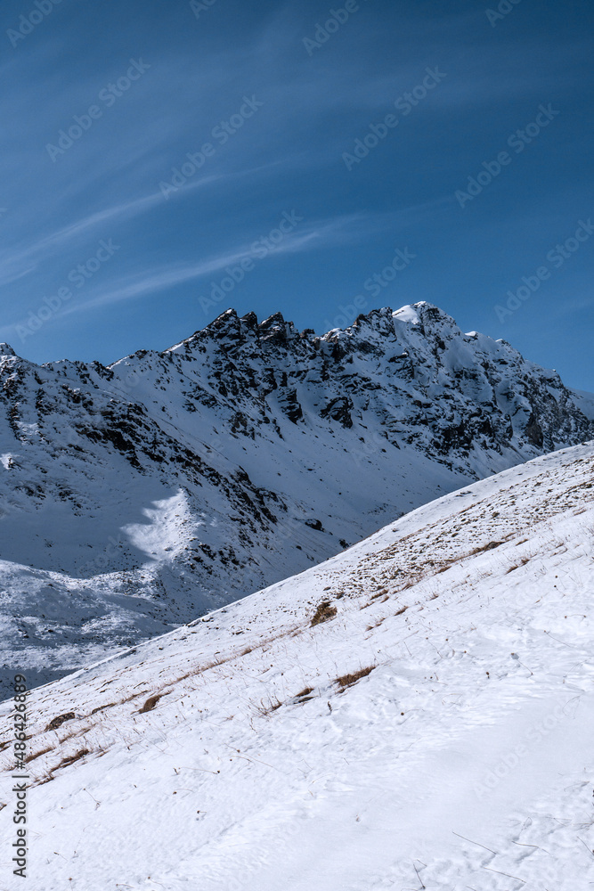 Mountains. Blue clear sky in nice winter day. Caucasus, Elbrus region.